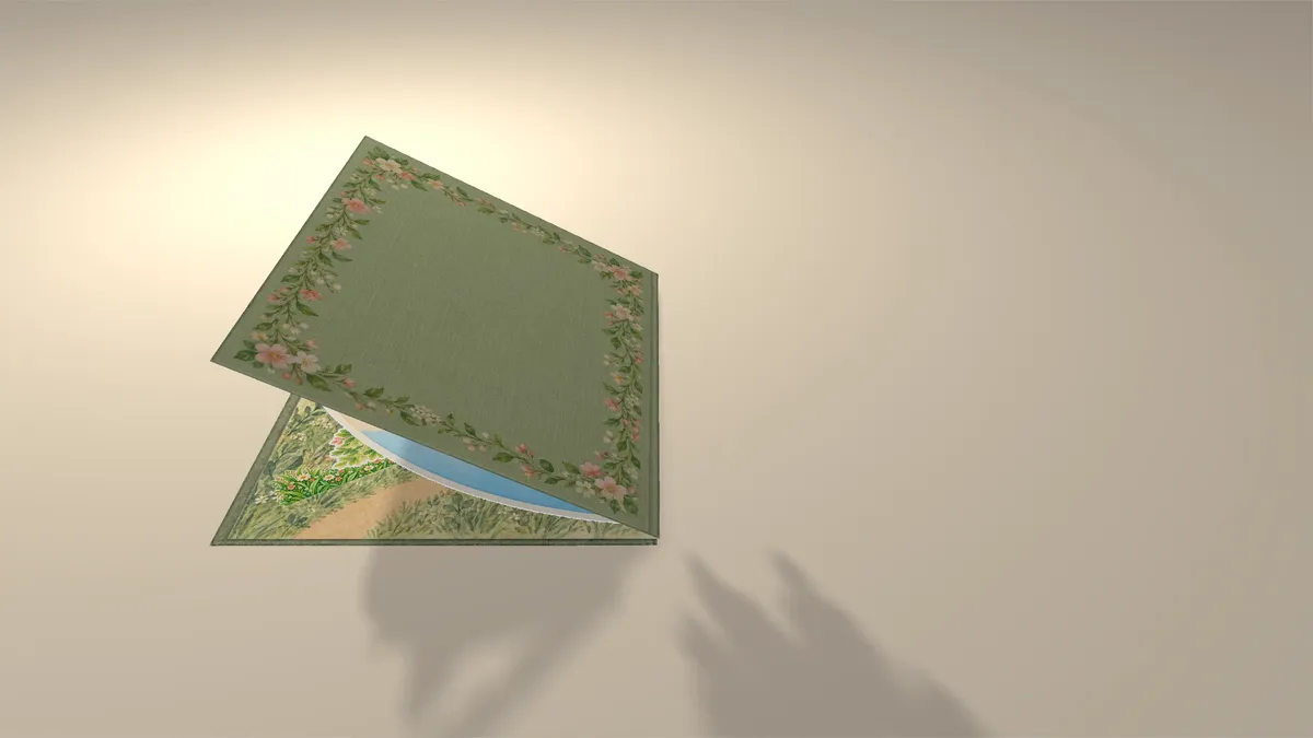 The pieces folded flat and the book's green cover closing over them, its shadow on the table